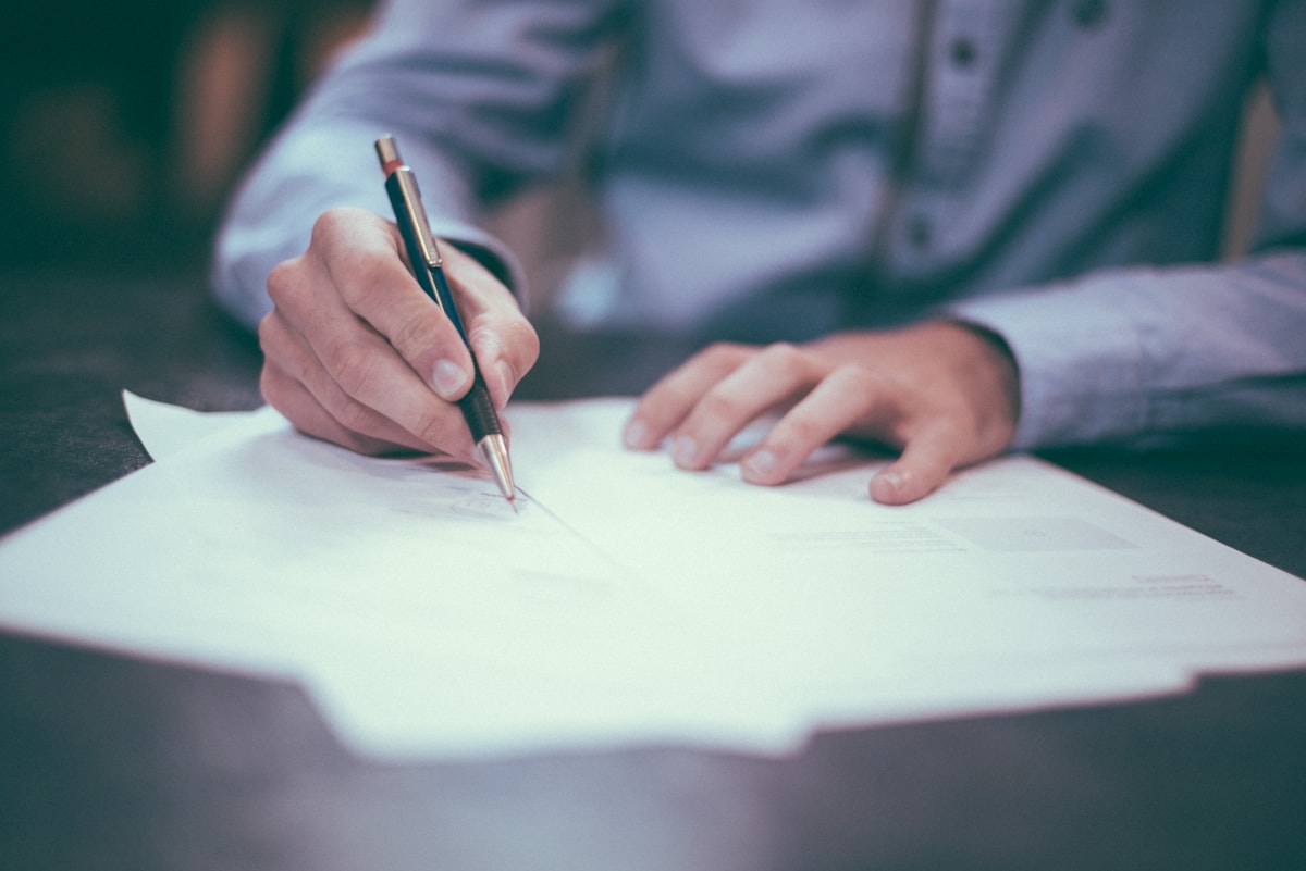 Professionals reviewing documents for cross-border market entry