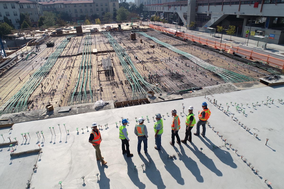 Project professionals planning infrastructure development on site